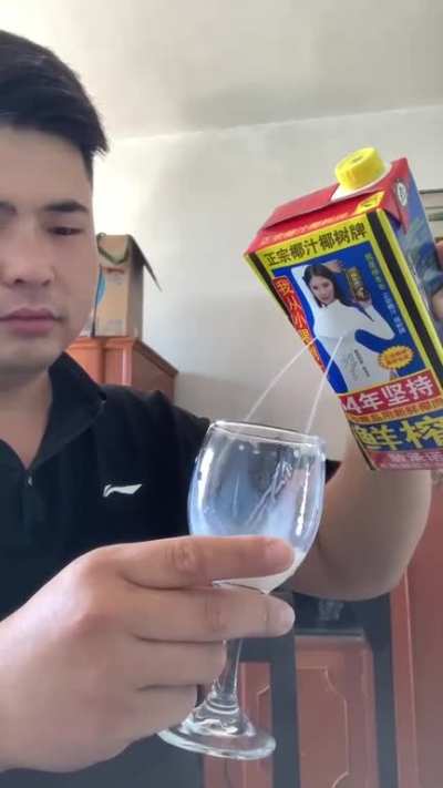 Typical Chinese way to drink coconut milk.