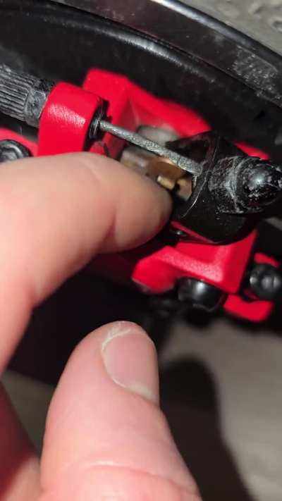 Rear brake pads making noise on bumps