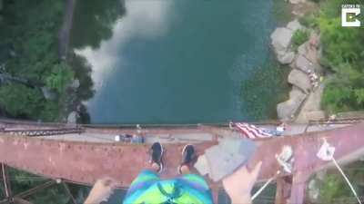 Daredevil jumps off 105ft bridge