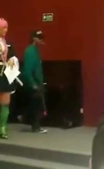 Crowd goes crazy at an anime convention...