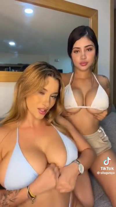 Huge breasts in bikinis.  
