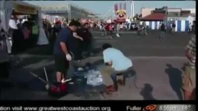 Reporter knocks over a man&rsquo;s ice sculpture.