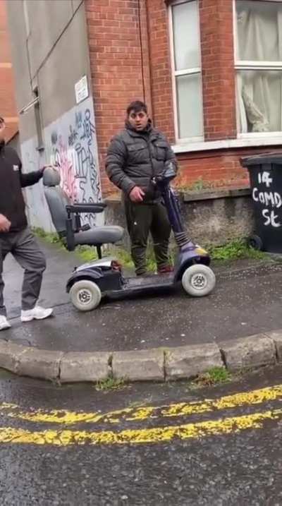 Two men steal a scooter, get a telling-off from a British lady