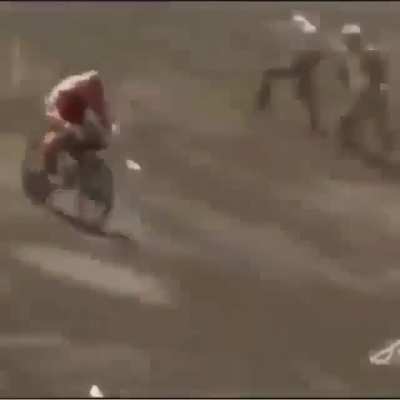 Trying to ride off a big sand hill with bmx