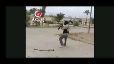 Insurgents fight against US soldiers early in the Iraq War.