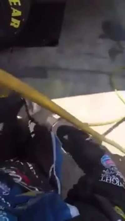 Mechanic Kyle Warner Finishes the pit stop after getting hit by another truck