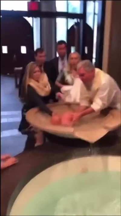 Baby gets baptized