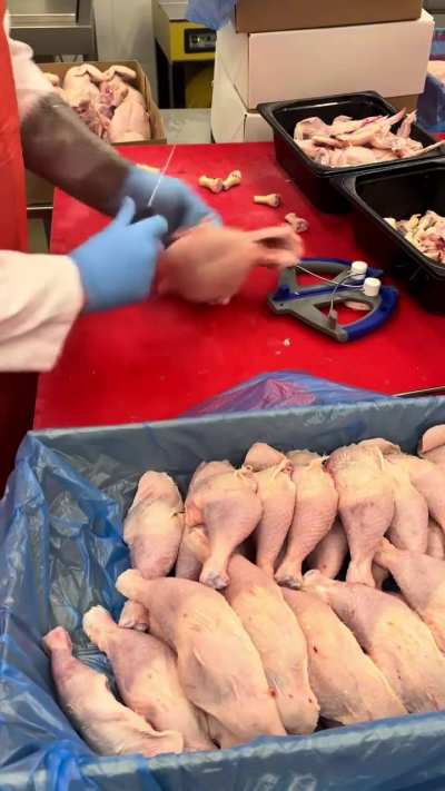 Cutting chicken leg quarters