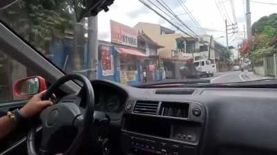 launching the car in front of their friend's shop.