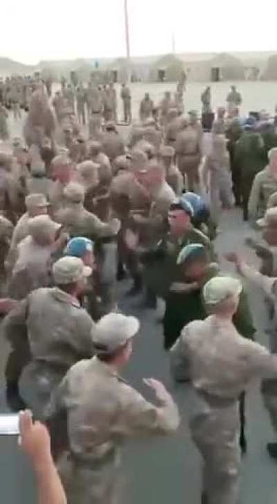 Kazakh and Tajik soldiers dance to Uzbek music during military exercises in Central Asian countries and Azerbaijan
