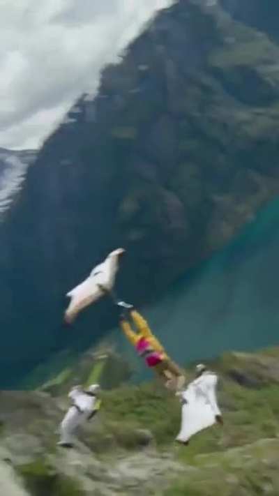 Base jumper transferring "bases" mid-air