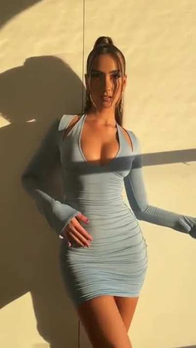 Priscilla, wearing different ohpolly sets in a stunning video