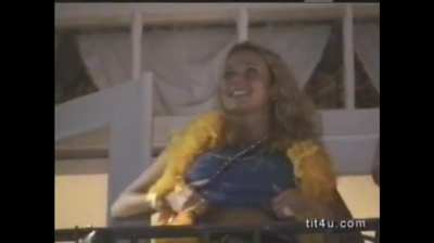 Busty blonde flashes her bigguns all over for beads 