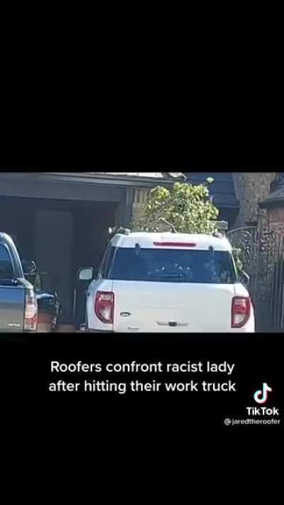 Racist woman damages work truck and hurls slurs.