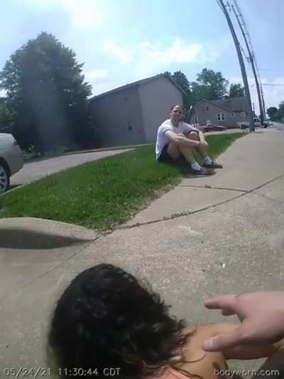 Crazed Woman drags an officer by car, breaking two of his bones. Officer still manages to arrest her.