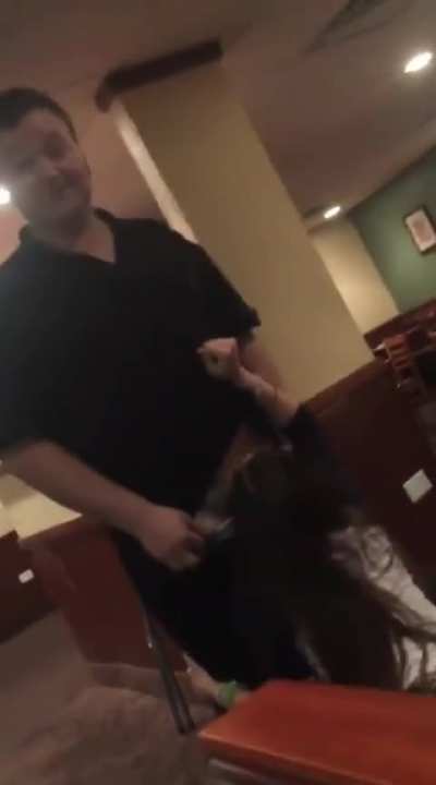 BJ in what appears to be a group of coworkers at a restaurant after hours