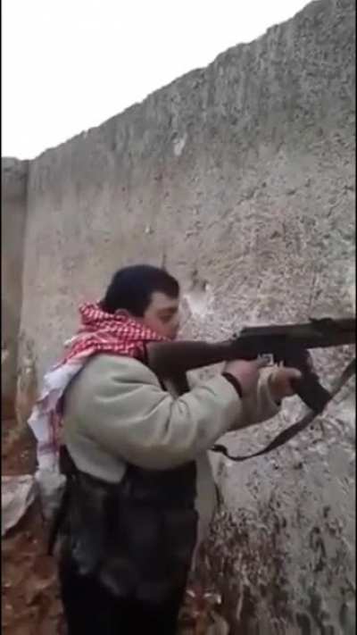 /r/CombatFootage: Isis fighter with Down syndrome, with an ak 74, popping shots, sometime in 2017.