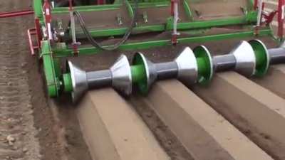 A rotary-ridging cultivator for making planting ridges in soil.