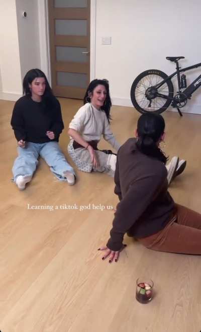 Charli looking cute while teaching her family tik toks today 