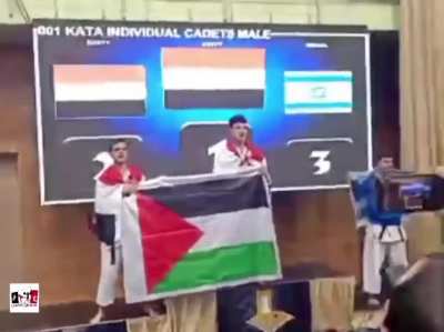Video of the two players of the U-15 Egyptian youth team for traditional karate raising the flag of Palestine after winning the 1st &amp;amp; 2nd places in the World ITKF Traditional Karate Championship, held in Slovenia.