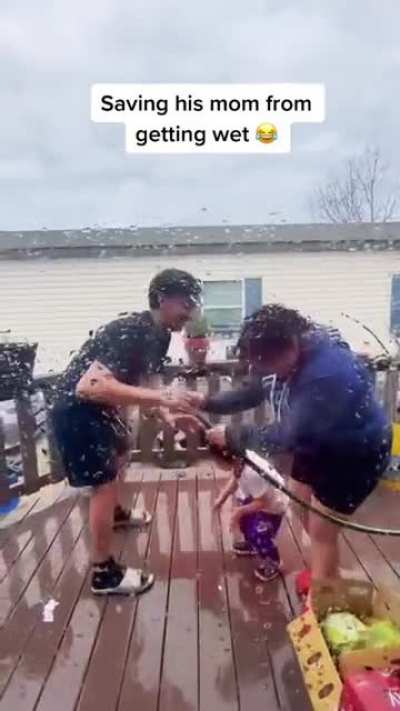 Young buddy saves his mom from getting wet
