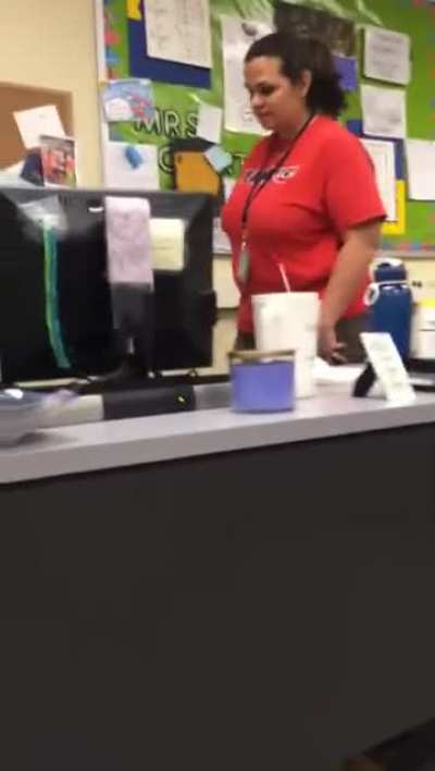 Student hides below the  teacher's desk and grabs the teacher's foot