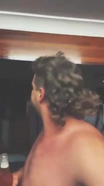 Watch how he flips the cigarette and drink the beer in a second.