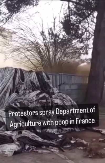 French Protestor in a tractor sprays poop at a facility maintained by the Department of Agriculture