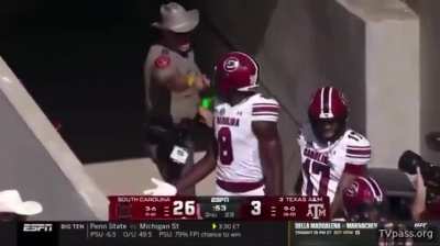 Texas A&amp;amp;M cop at Kyle Field shoves into two South Carolina football players after Nyck Harbor scores TD