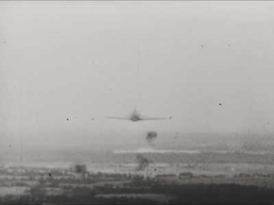 Soviet Polikarpov I-16 fighter loses its tail to cannon fire from a Luftwaffe Bf 109 in the Summer of 1941