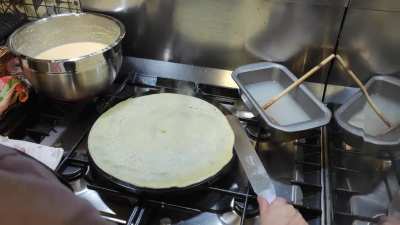 Today is candlemas day, aka "cr&ecirc;pe day" for us in France, this is my mother baking a cr&ecirc;pe on her cast iron "cr&ecirc;pi&egrave;re"