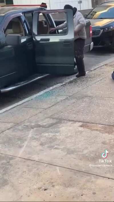 Homeless man breaking into a car in Dallas