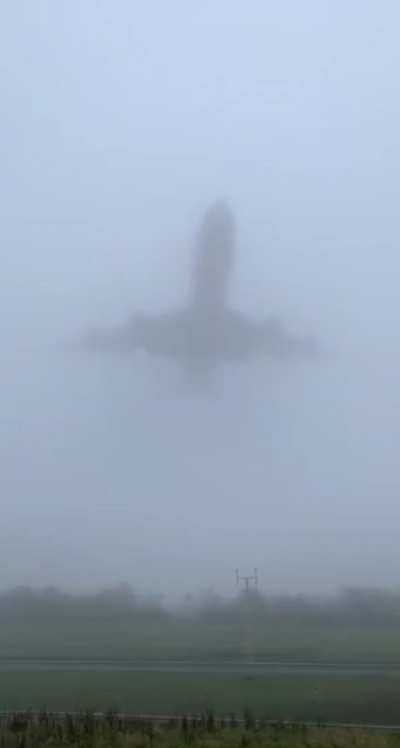 747 low pass on a foggy day