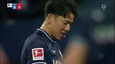 Fans of Union Berlin throwing chocolate coins on the pitch at Bochum to protest against Bundesliga investor plans &ndash; Takuma Asano eats it