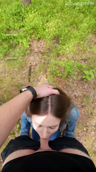 In the woods pushing my head deeper till I gag on his cock