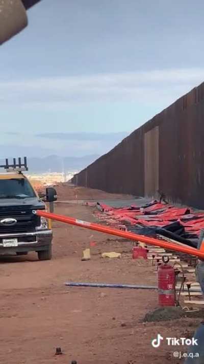 Randomly filming some workmen and a dude scales the wall, yeaaaah, not having it...