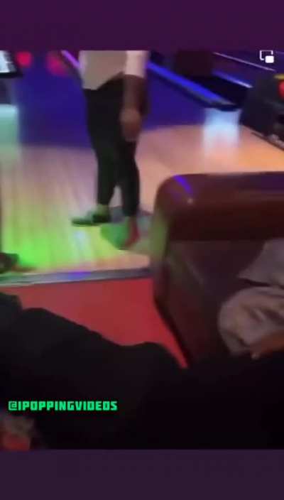 Caption says "Man And His Date Argue In A Bowling Alley, And Lady Uses A Bowling Ball To Eliminate Him"