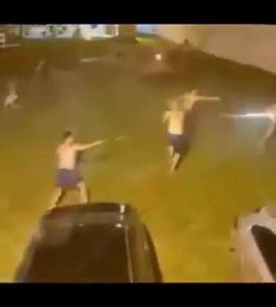 Shooting fireworks at one another... while half naked.