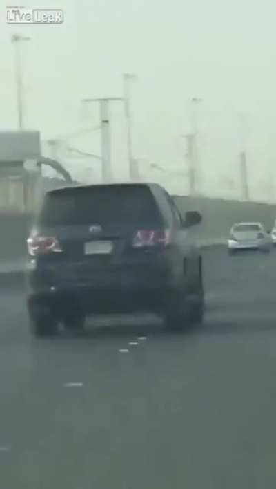 Sticking yourself out a car window to hit another car? Great idea!