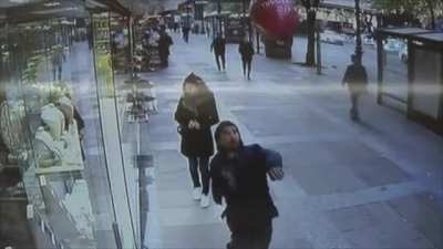 Trying to kick a balloon on the street