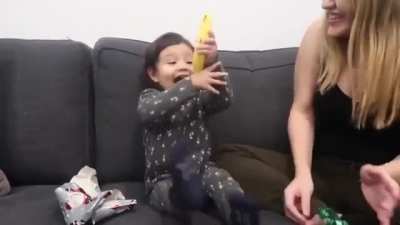 This girl's reaction to getting a banana!