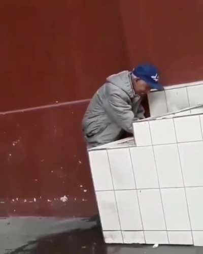 An elderly gentleman helping out a thirsty street doggo