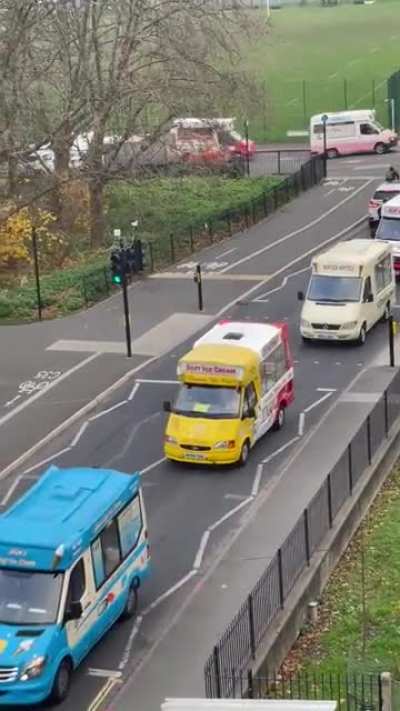 An ice cream man's funeral, with ice cream vans following in solidarity.