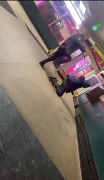 East Cleveland police officer kicking a kneeling black man