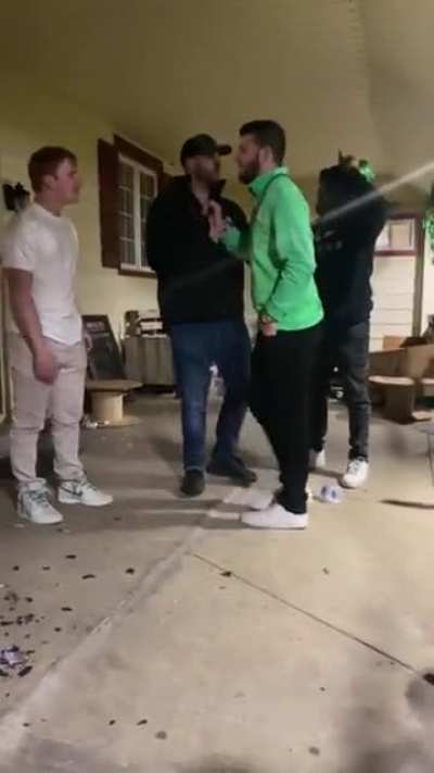 Guy in green was apparently being a real d-bag all night. Trying to pick a fight with whoever he could.