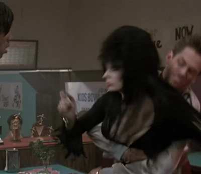 Cassandra Peterson's nip slip - Elvira: Mistress of the Dark (1988)