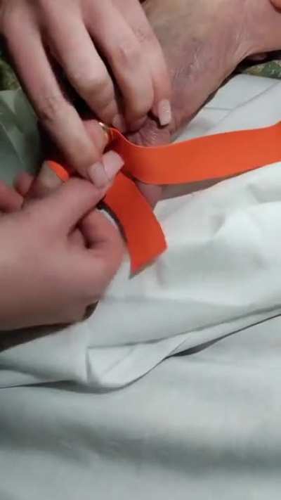 Removing a ring, that's stuck on a finger, using a tourniquet