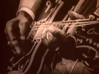 Mississippi Fred McDowell&rsquo;s playing infectious. This song is &lsquo;Shake &lsquo;Em On Down&rsquo; and video is in the 1960s. Fred makes that guitar sound like a freight train. This man is somehow not even ranked in the top 100 guitarists of all time. I&rsquo;d put him near the 