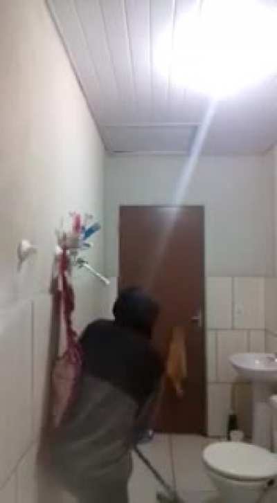 Boy trying to kill a rat