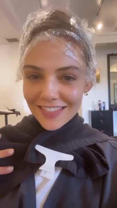 Doing her hair